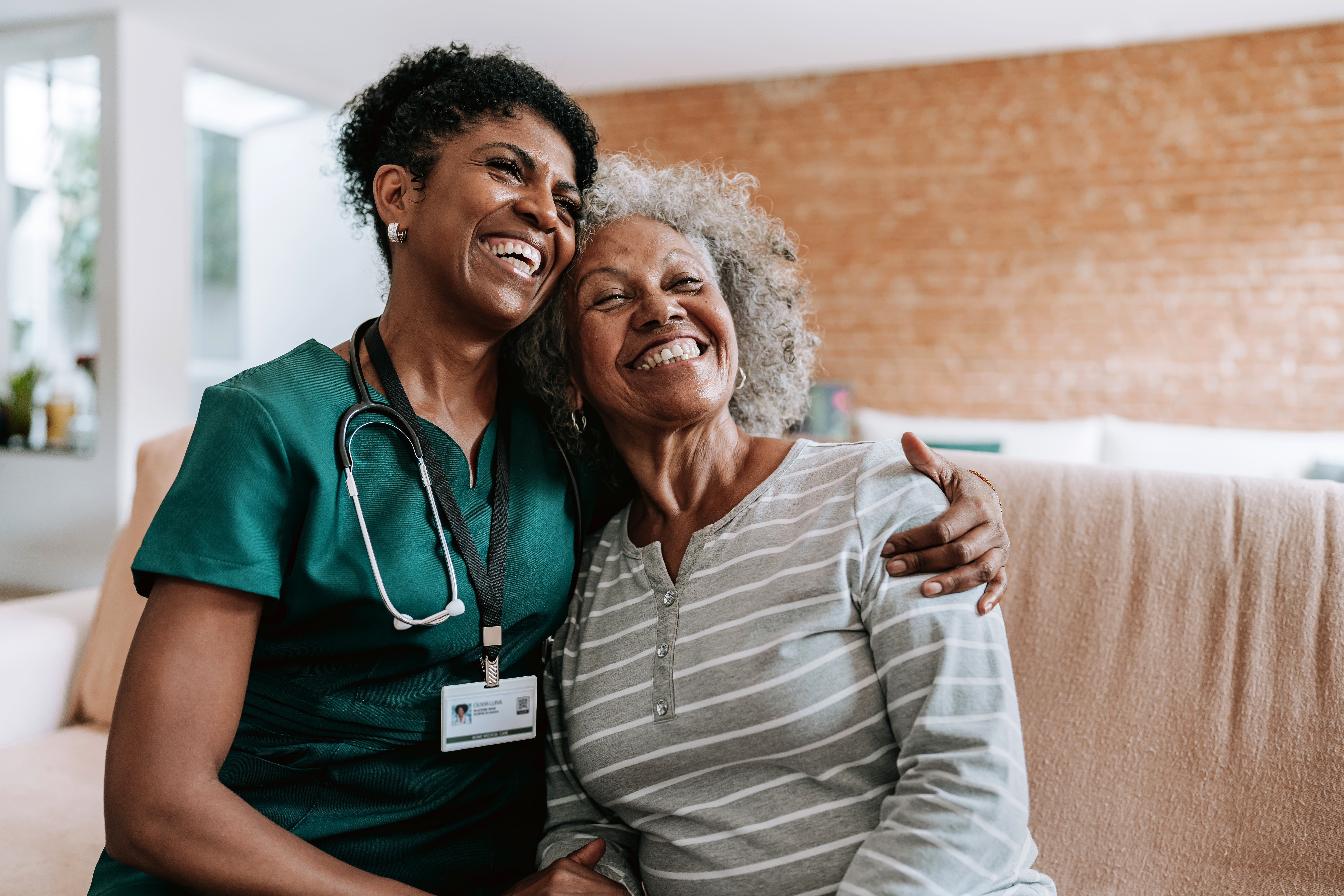 Provider and patient smiling after neuropathy treatment